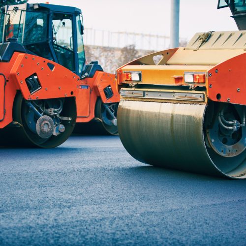 road-roller-working-on-the-new-road-construction-s-2023-11-27-05-34-02-utc (1)